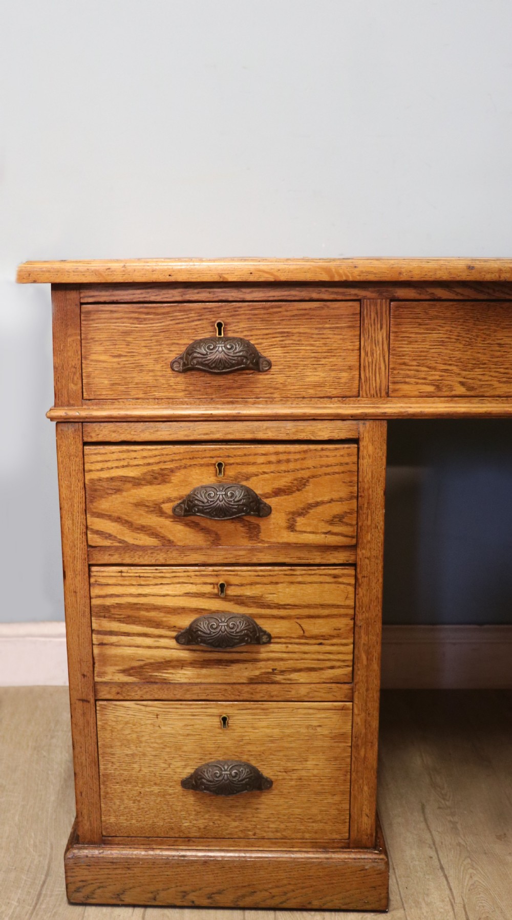 Victorian quality! A lovely late 19th century light oak twin pedestal desk.  View VIII