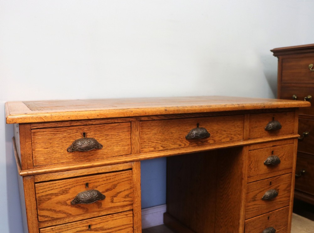 Victorian quality! A lovely late 19th century light oak twin pedestal desk.  View IX