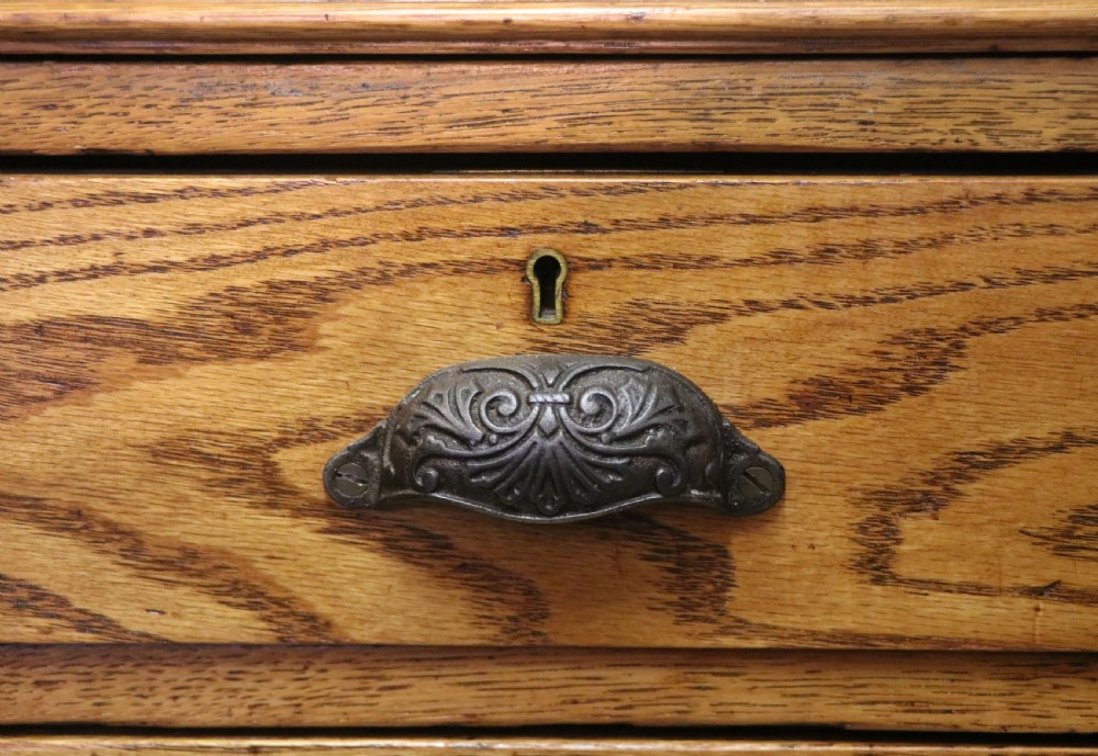 Victorian quality! A lovely late 19th century light oak twin pedestal desk.  View XV