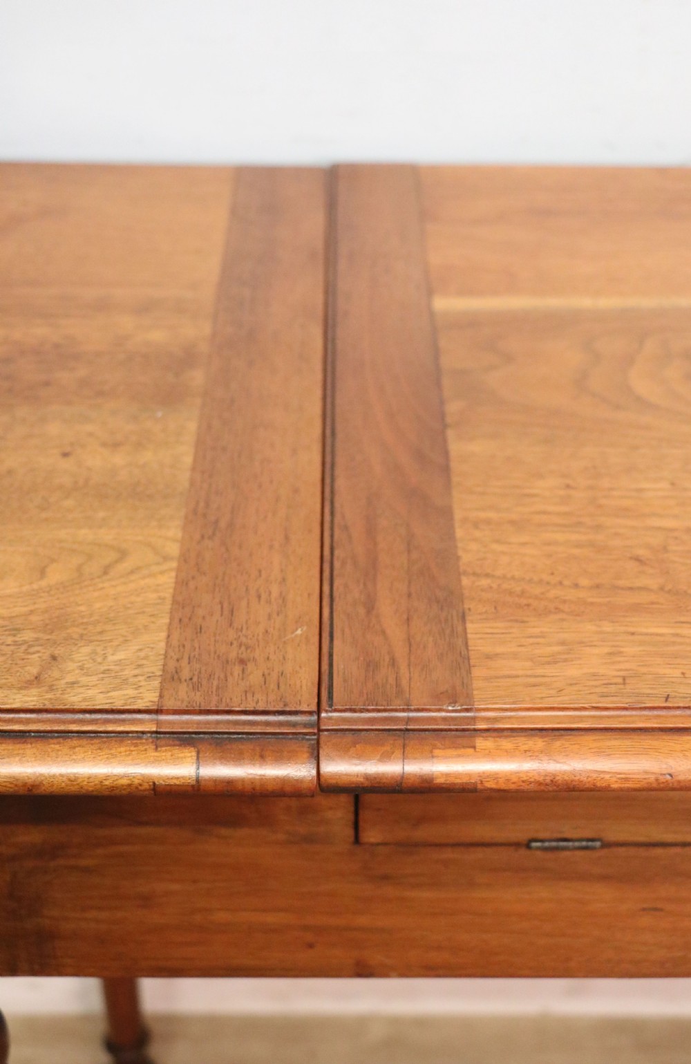 A brown walnut metamorphic writing desk featuring turned legs, side flaps, and an open top section exposing internal stationery compartments. View XIII