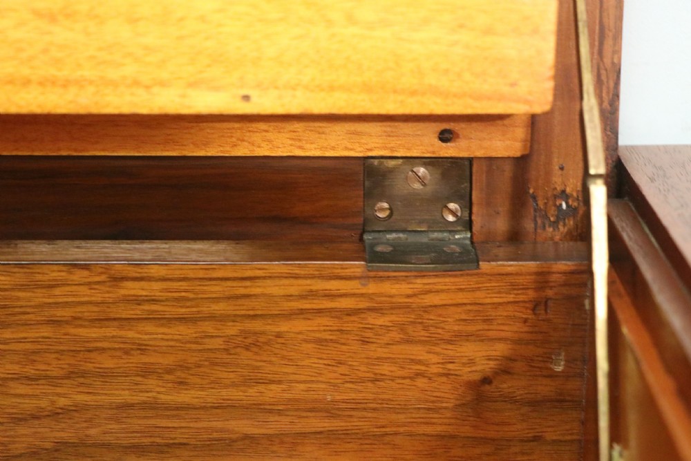 A brown walnut metamorphic writing desk featuring turned legs, side flaps, and an open top section exposing internal stationery compartments. View XXIII
