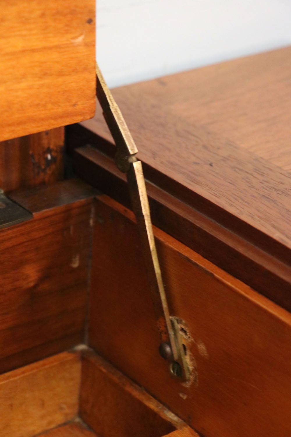 A brown walnut metamorphic writing desk featuring turned legs, side flaps, and an open top section exposing internal stationery compartments. View XXVI