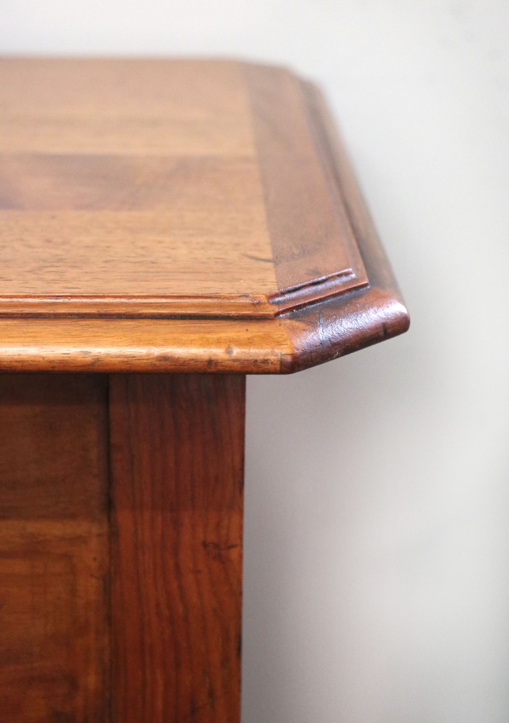 A brown walnut metamorphic writing desk featuring turned legs, side flaps, and an open top section exposing internal stationery compartments. View XXVIII