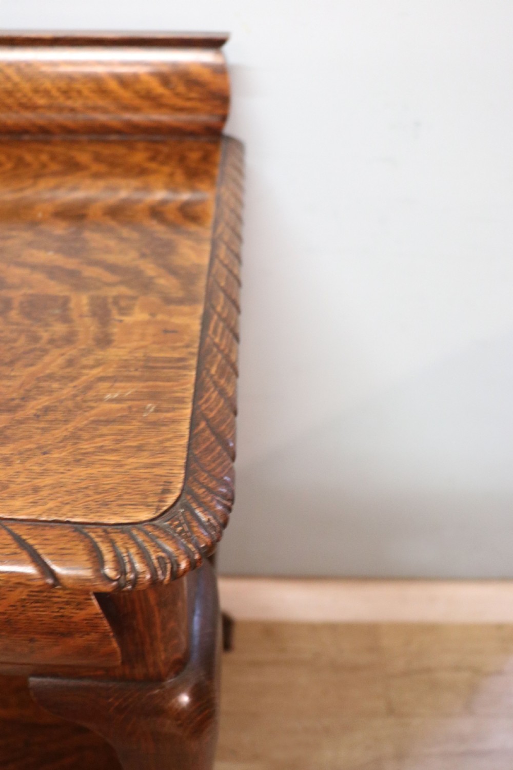 A Georgian revival oak side table featuring a single drawer with brass knobs, a lower tier shelf, and cabriole legs terminating in carved claw and ball feet. View XII