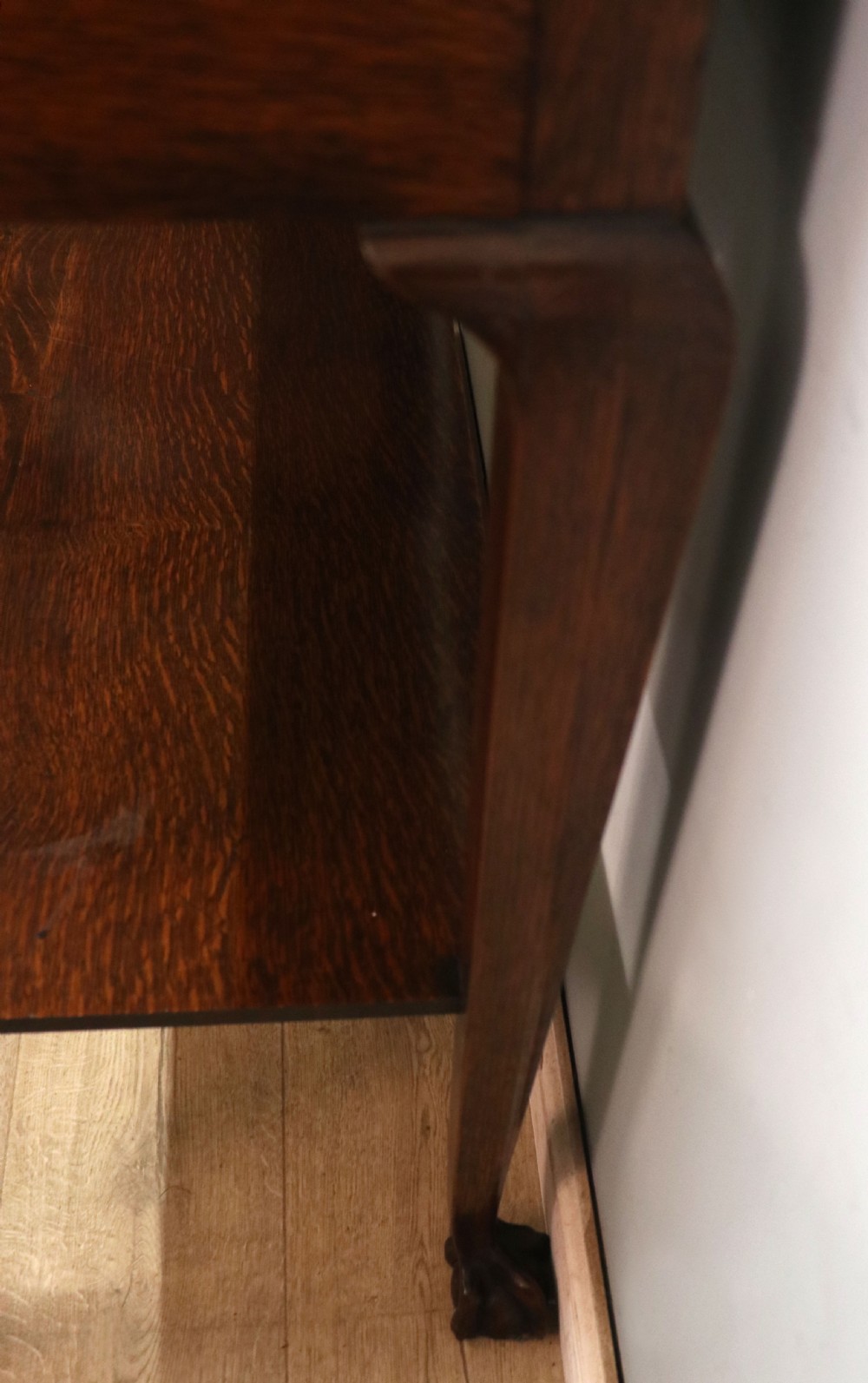 A Georgian revival oak side table featuring a single drawer with brass knobs, a lower tier shelf, and cabriole legs terminating in carved claw and ball feet. View XVIII