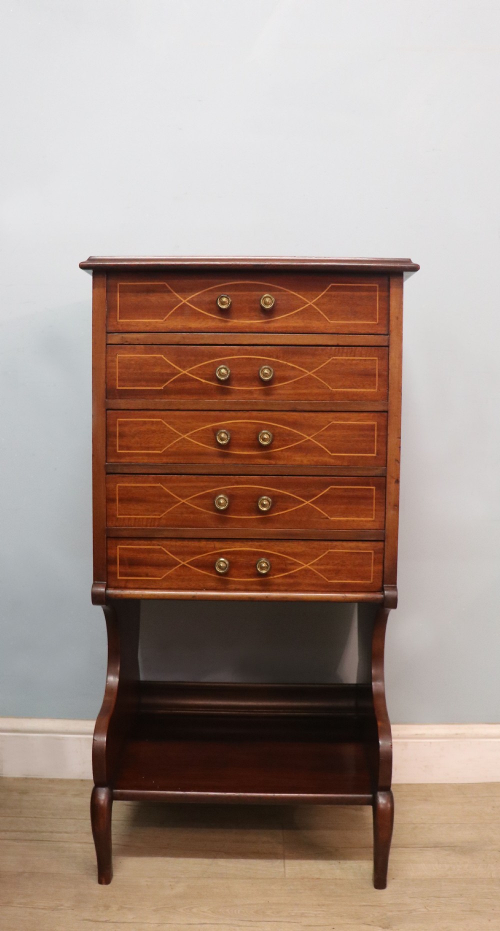 A lovely narrow mahogany and line inlaid music cabinet or chest of drawers