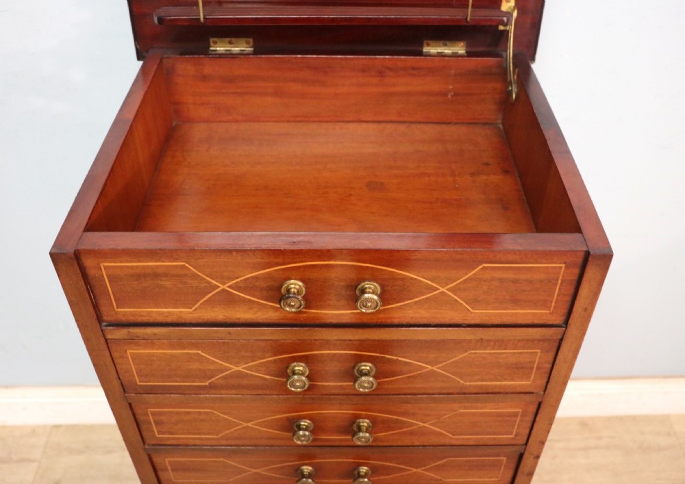 A lovely narrow mahogany and line inlaid music cabinet or chest of drawers View XVI