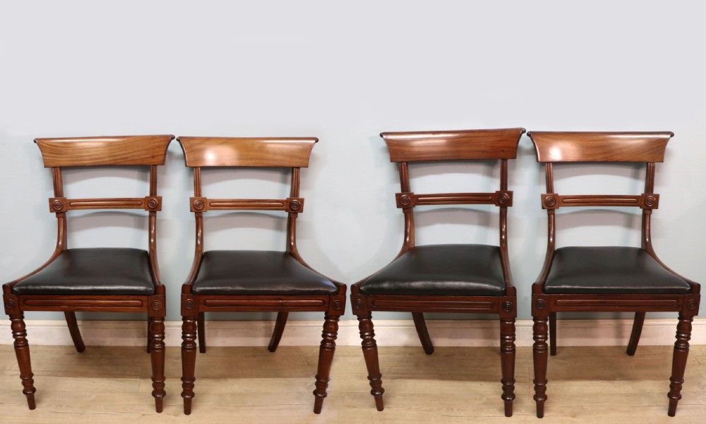 A lovely set of four late Georgian or William IV mahogany bar back dining chairs.