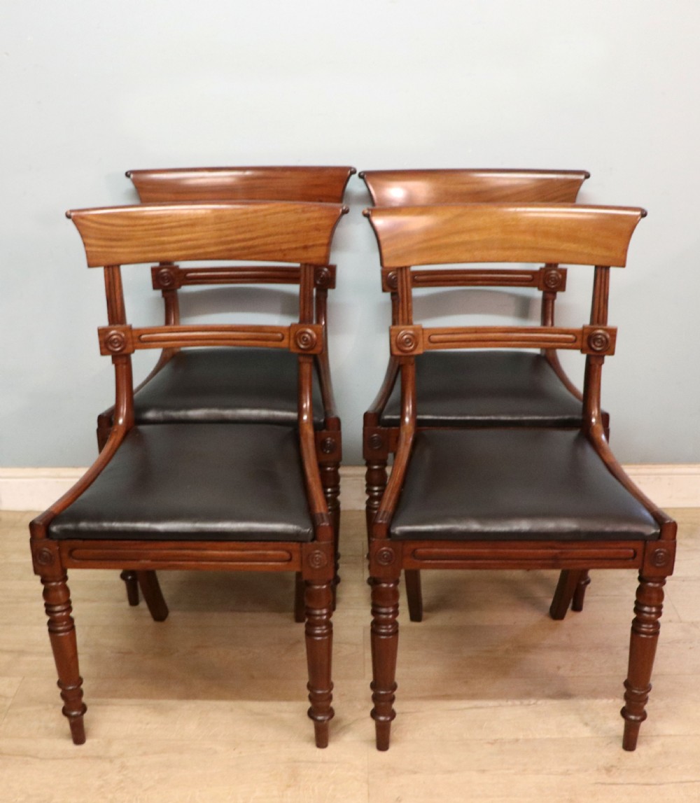 A lovely set of four late Georgian or William IV mahogany bar back dining chairs. View IV