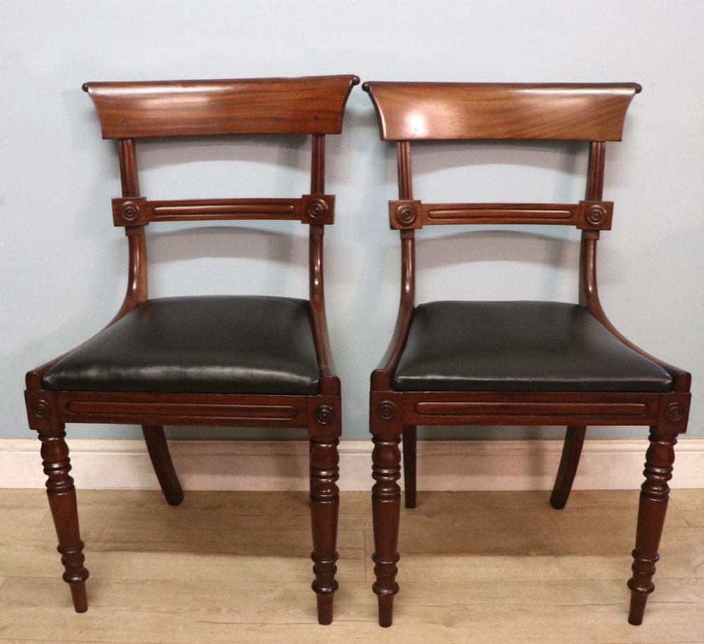A lovely set of four late Georgian or William IV mahogany bar back dining chairs. View VII