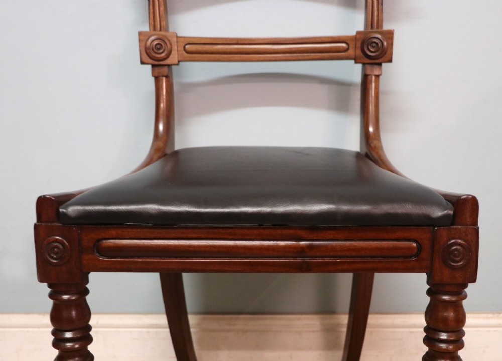 A lovely set of four late Georgian or William IV mahogany bar back dining chairs. View VIII