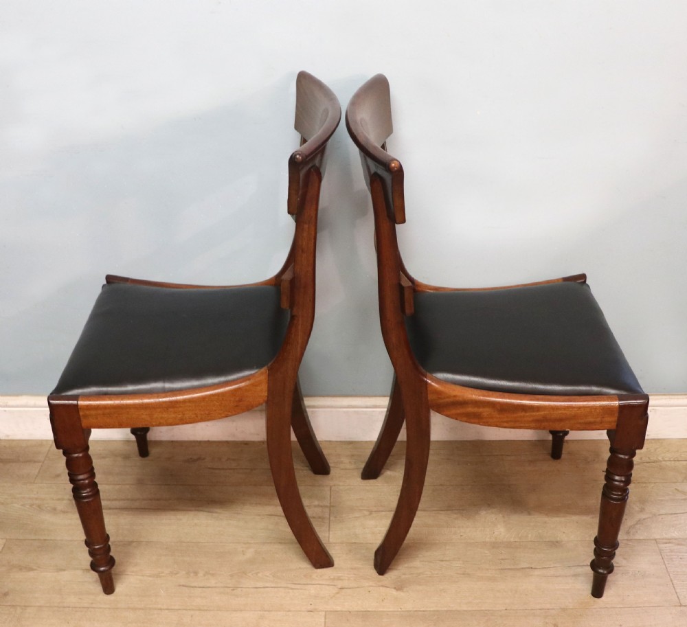 A lovely set of four late Georgian or William IV mahogany bar back dining chairs. View XI