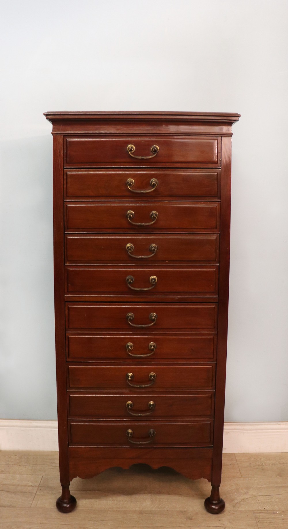A lovely unusual early 20th century mahogany music cabinet or chest with ten drawers.