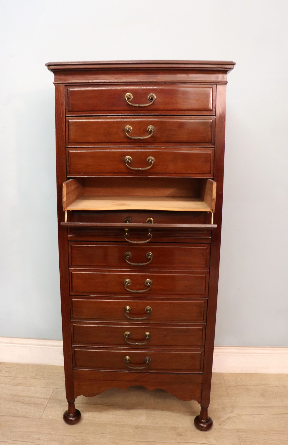 A lovely unusual early 20th century mahogany music cabinet or chest with ten drawers. View VI