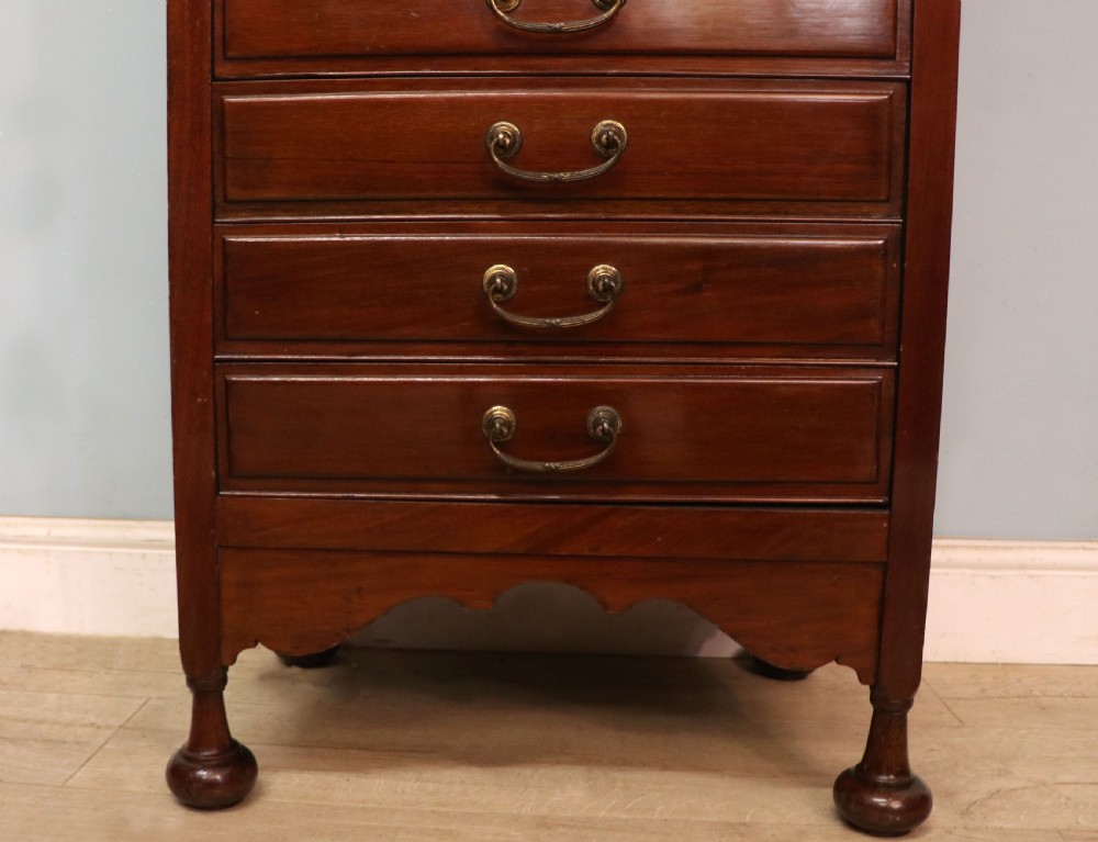 A lovely unusual early 20th century mahogany music cabinet or chest with ten drawers. View XXII