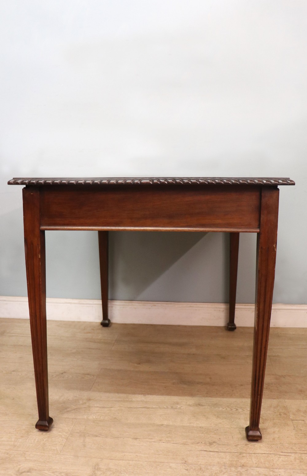 An Edwardian rectangular mahogany side table featuring carved rope-twist edging and square tapered legs. View III