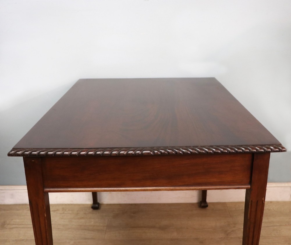 An Edwardian rectangular mahogany side table featuring carved rope-twist edging and square tapered legs. View V