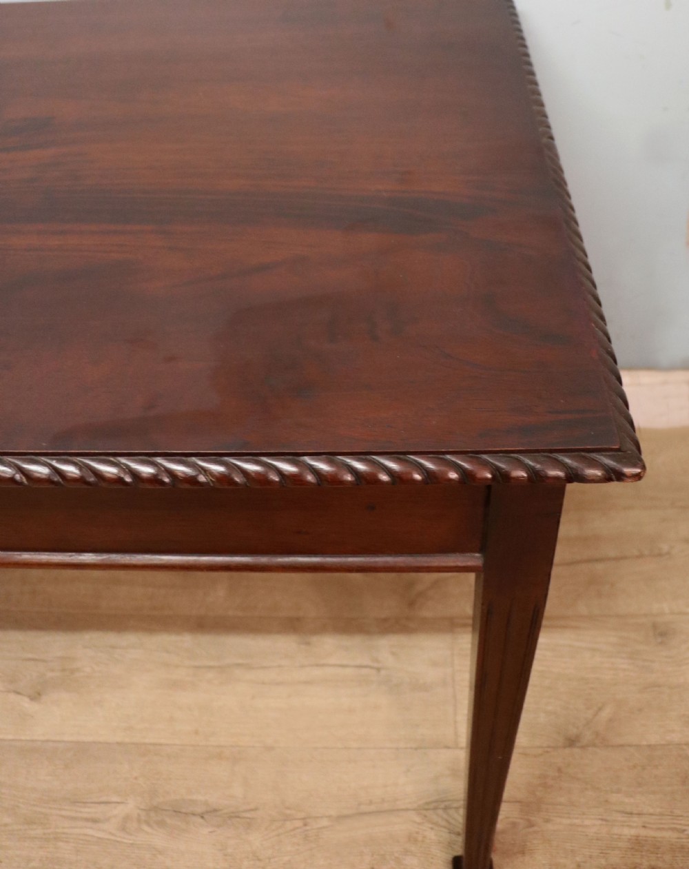 An Edwardian rectangular mahogany side table featuring carved rope-twist edging and square tapered legs. View IX