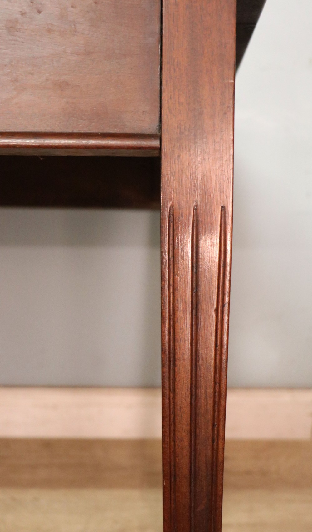 An Edwardian rectangular mahogany side table featuring carved rope-twist edging and square tapered legs. View XV