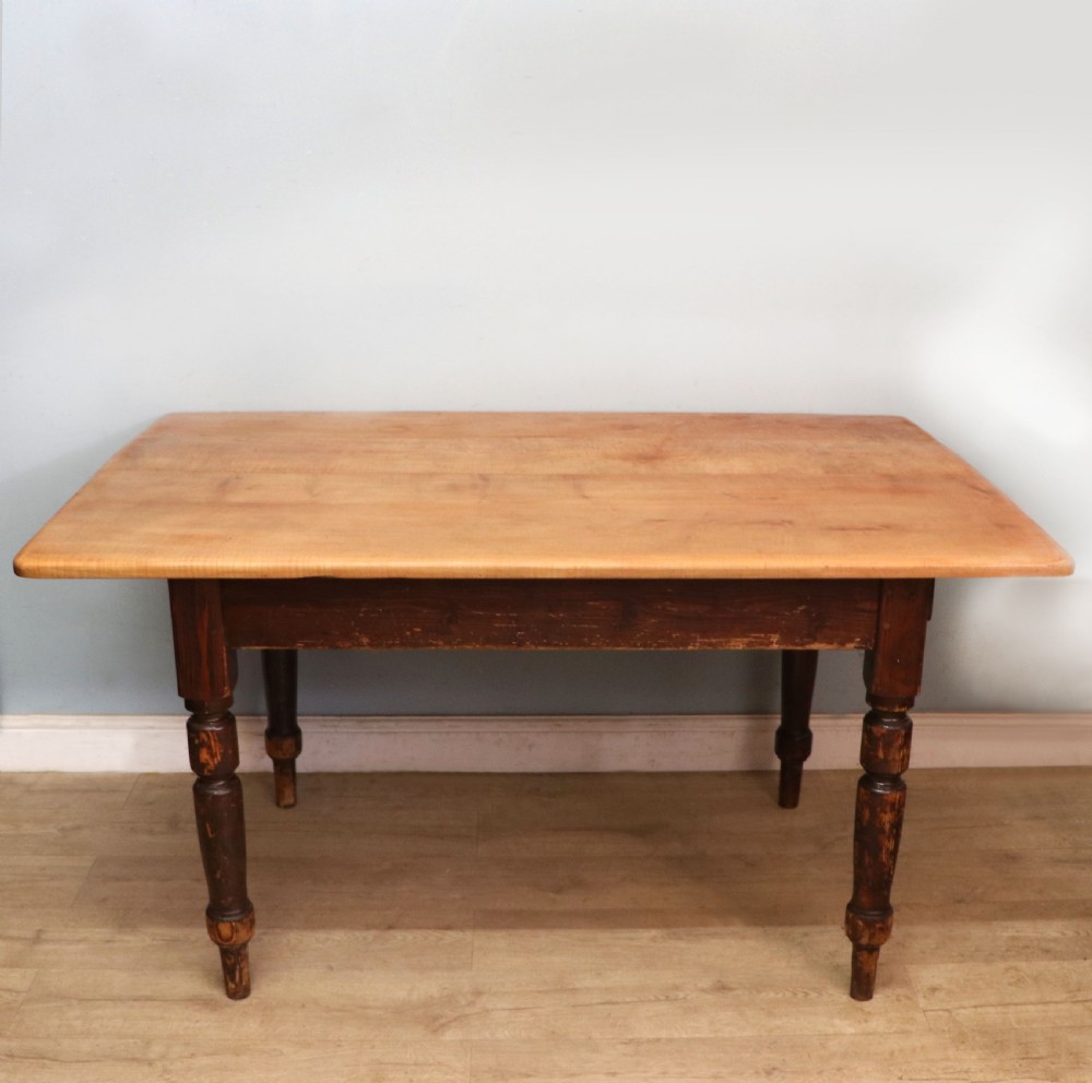 A lovely Victorian pine kitchen table with plank top.