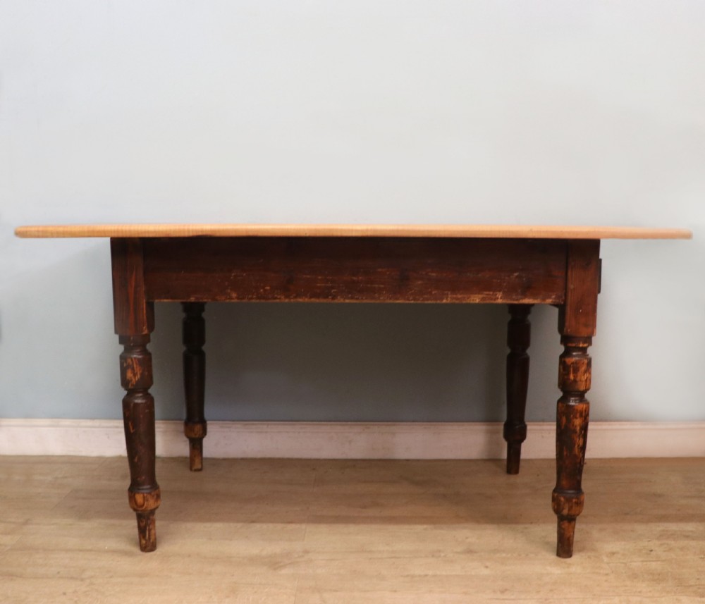A lovely Victorian pine kitchen table with plank top. View II