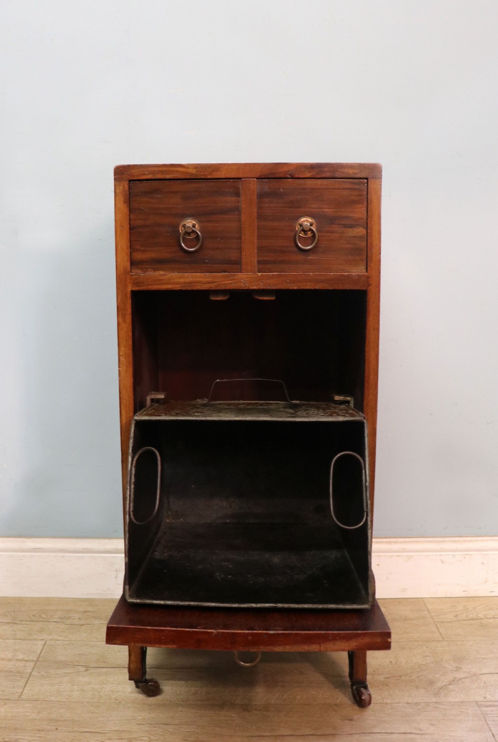 A tall dark wood Art Nouveau coal box featuring botanical marquetry inlay and brass ring handles, supported on castors. View II
