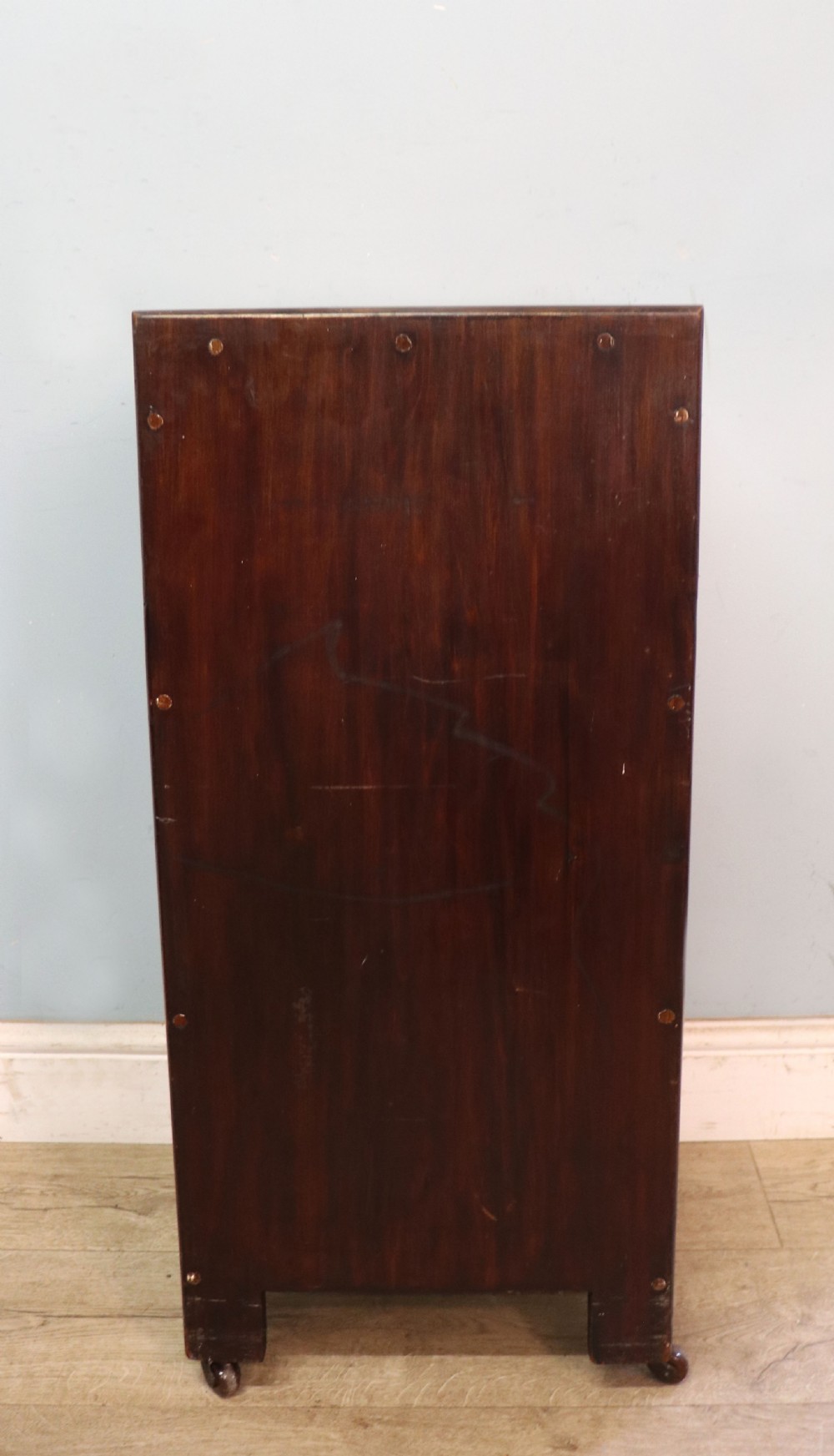 A tall dark wood Art Nouveau coal box featuring botanical marquetry inlay and brass ring handles, supported on castors. View VII