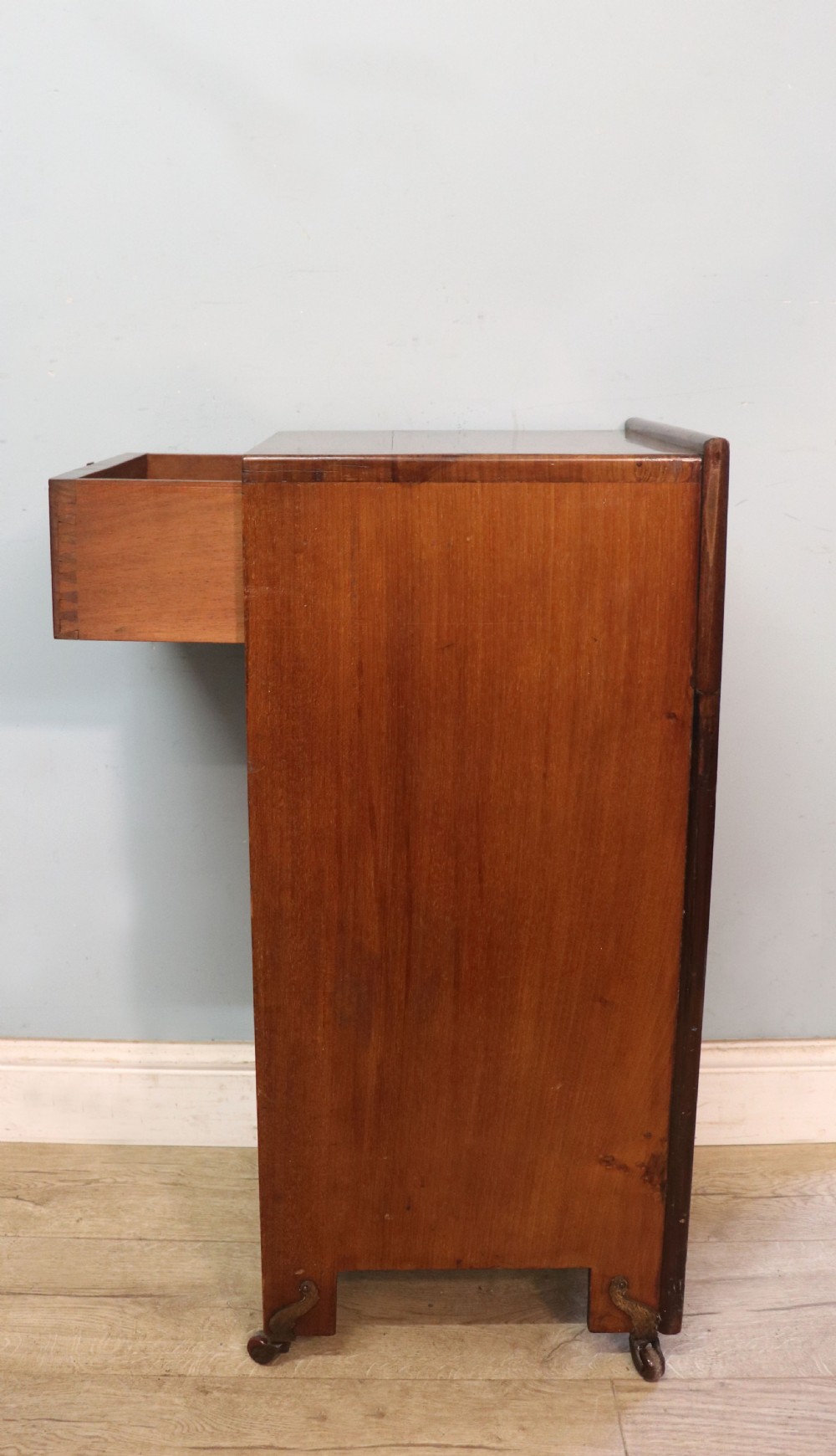 A tall dark wood Art Nouveau coal box featuring botanical marquetry inlay and brass ring handles, supported on castors. View VIII