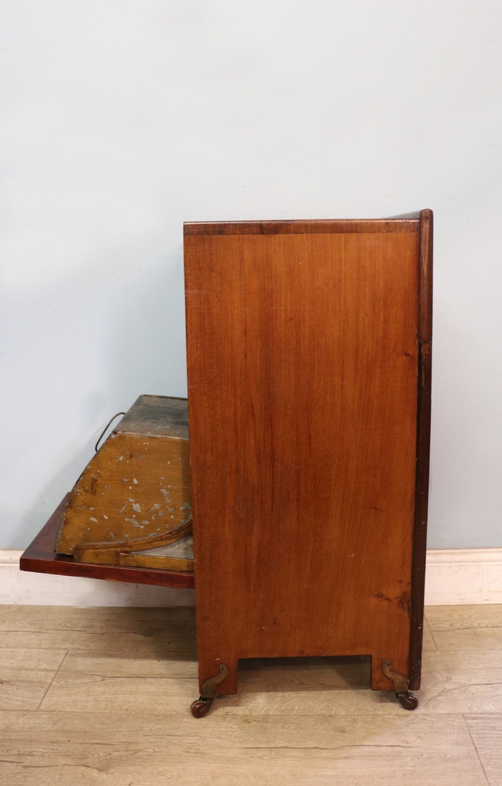A tall dark wood Art Nouveau coal box featuring botanical marquetry inlay and brass ring handles, supported on castors. View XII