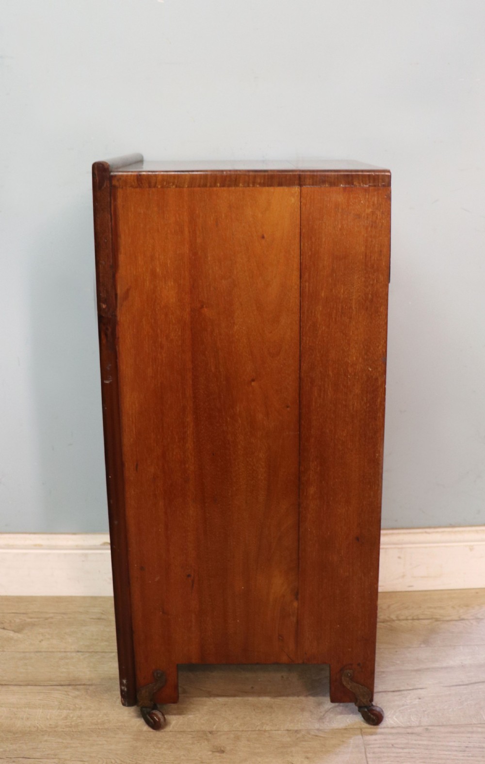 A tall dark wood Art Nouveau coal box featuring botanical marquetry inlay and brass ring handles, supported on castors. View XVI