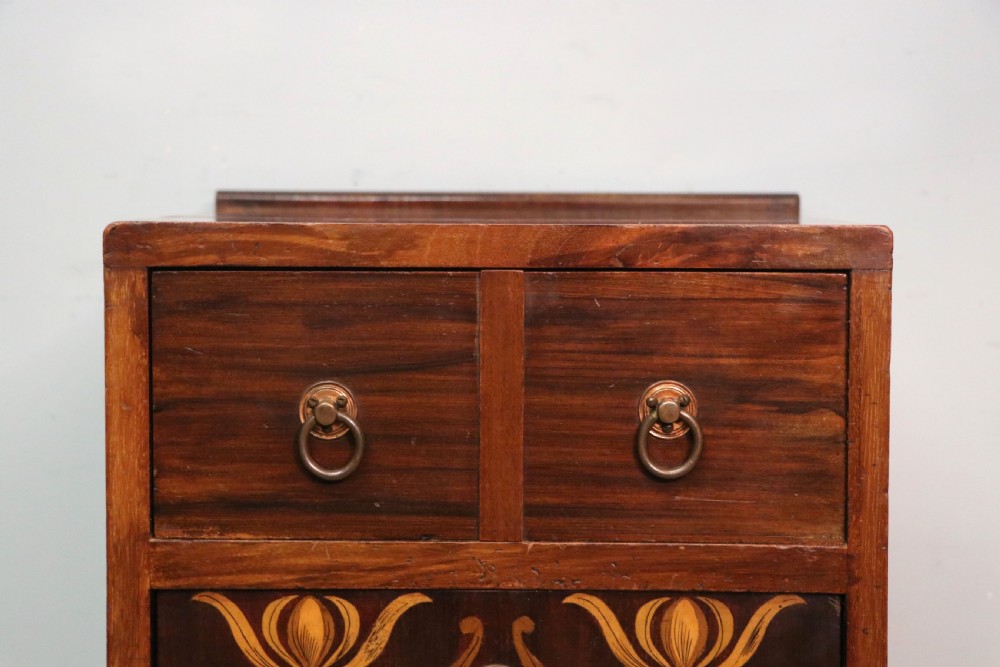 A tall dark wood Art Nouveau coal box featuring botanical marquetry inlay and brass ring handles, supported on castors. View XVIII