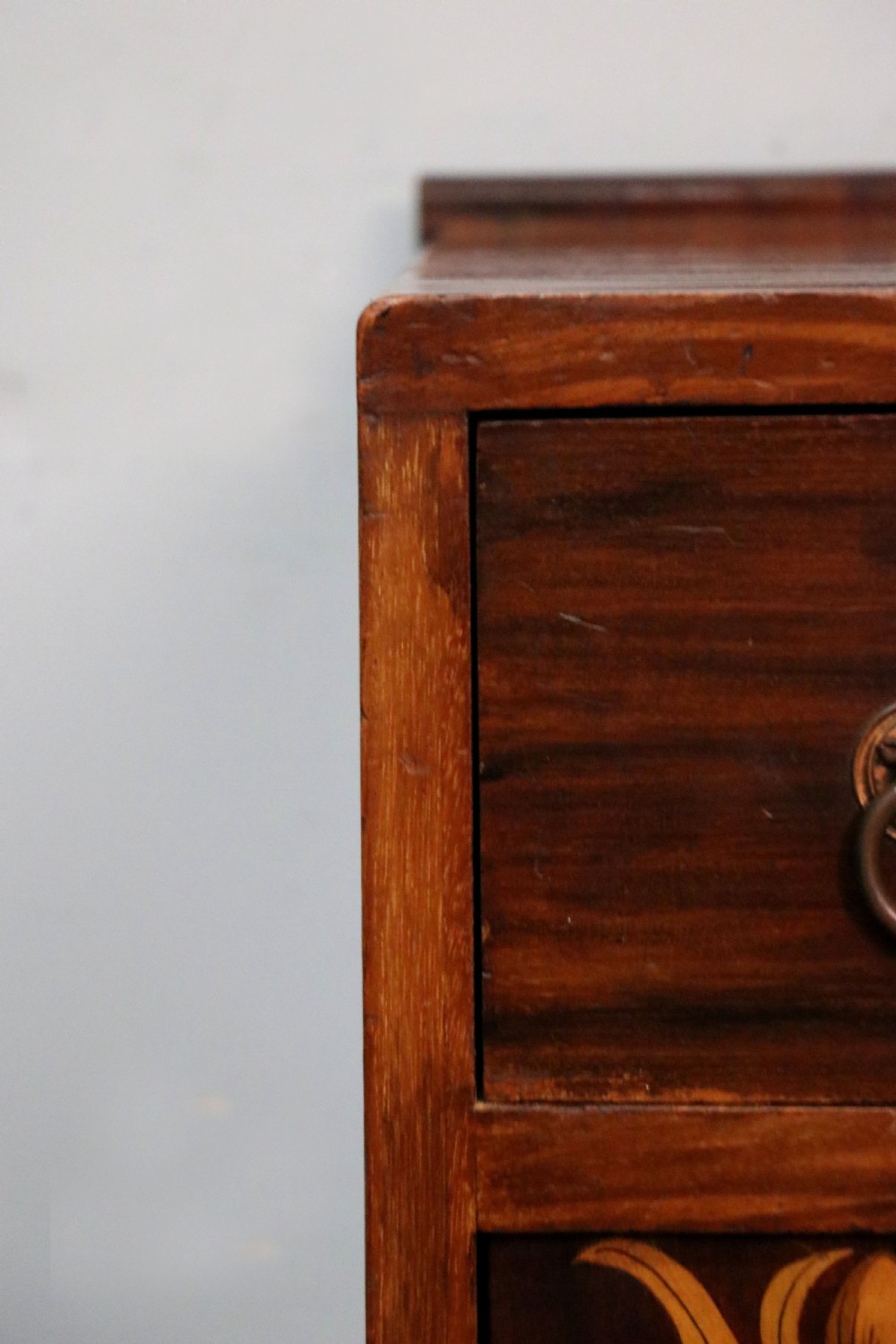 A tall dark wood Art Nouveau coal box featuring botanical marquetry inlay and brass ring handles, supported on castors. View XX