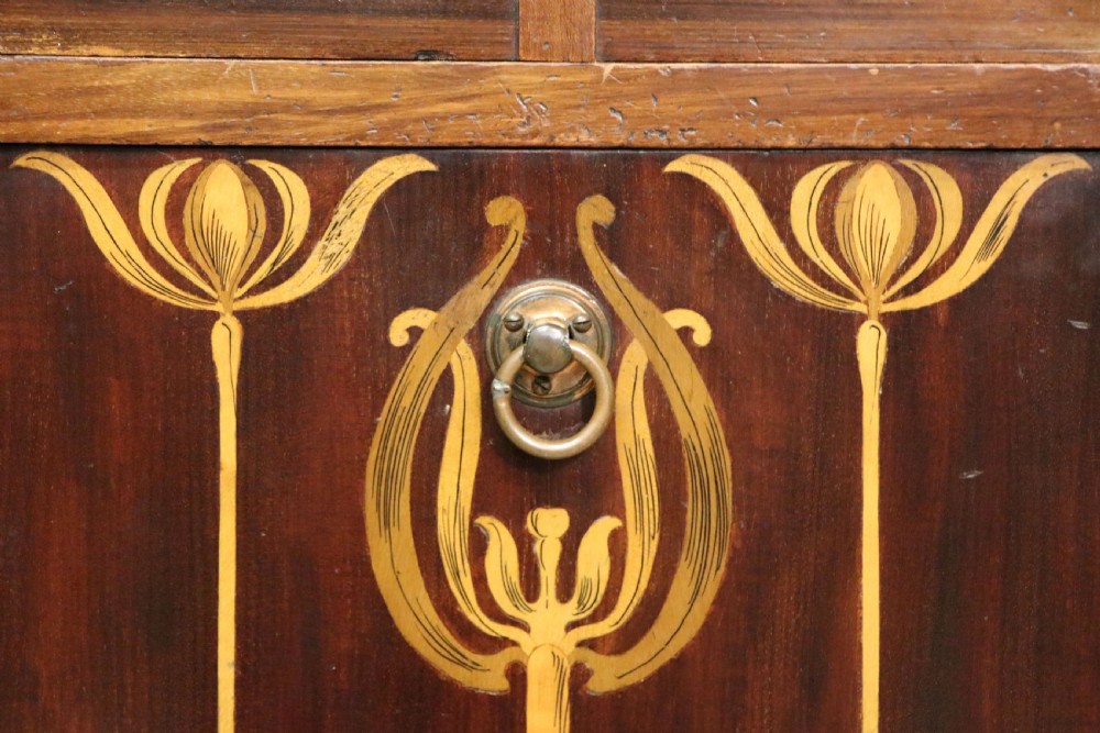 A tall dark wood Art Nouveau coal box featuring botanical marquetry inlay and brass ring handles, supported on castors. View XXVIII