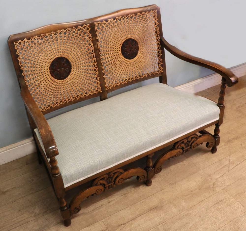  A charming early 20th century two-seater solid oak framed sofa modelled in the late 17th century style.  View III