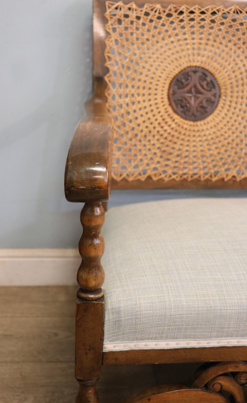  A charming early 20th century two-seater solid oak framed sofa modelled in the late 17th century style.  View IX