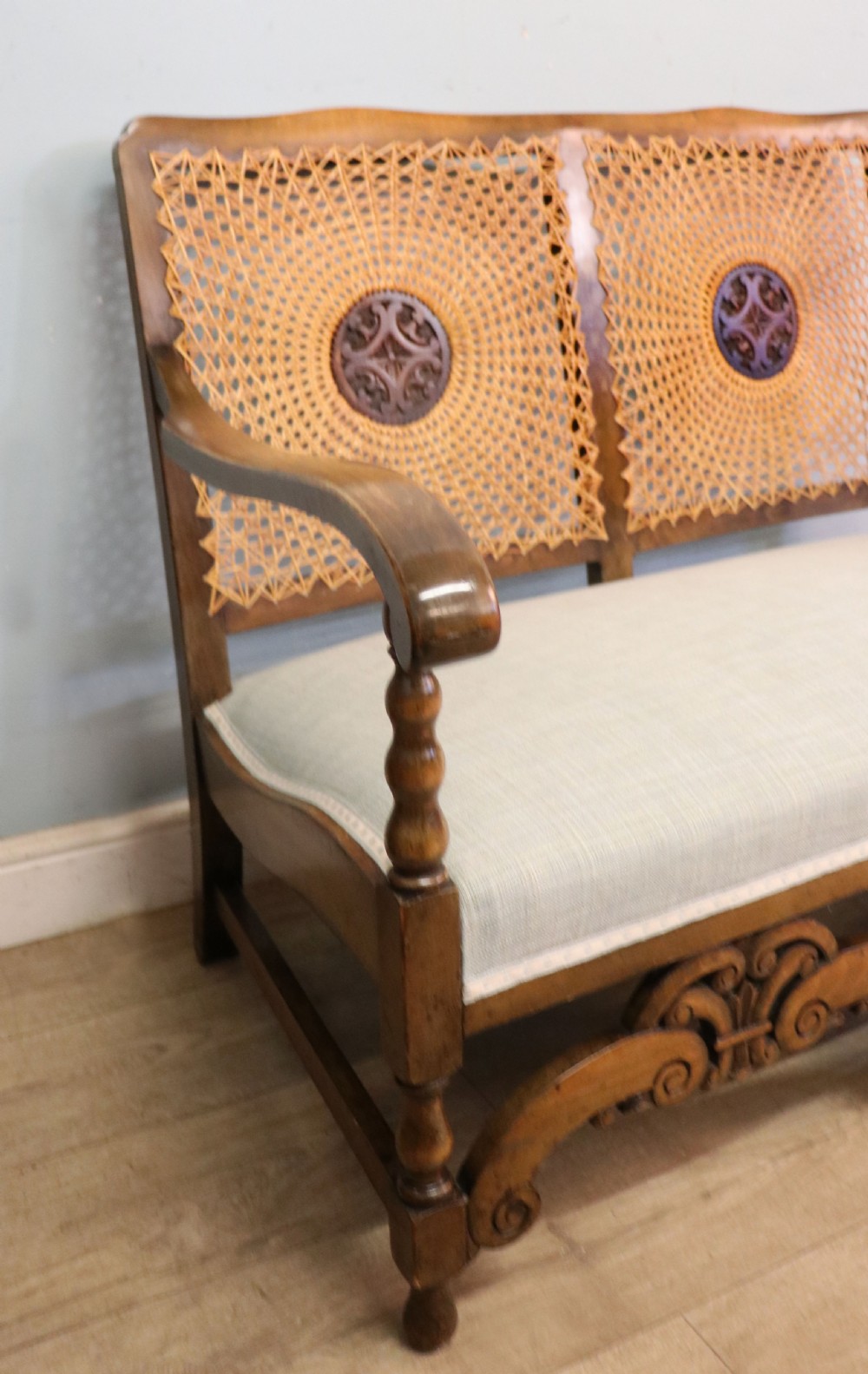  A charming early 20th century two-seater solid oak framed sofa modelled in the late 17th century style.  View X