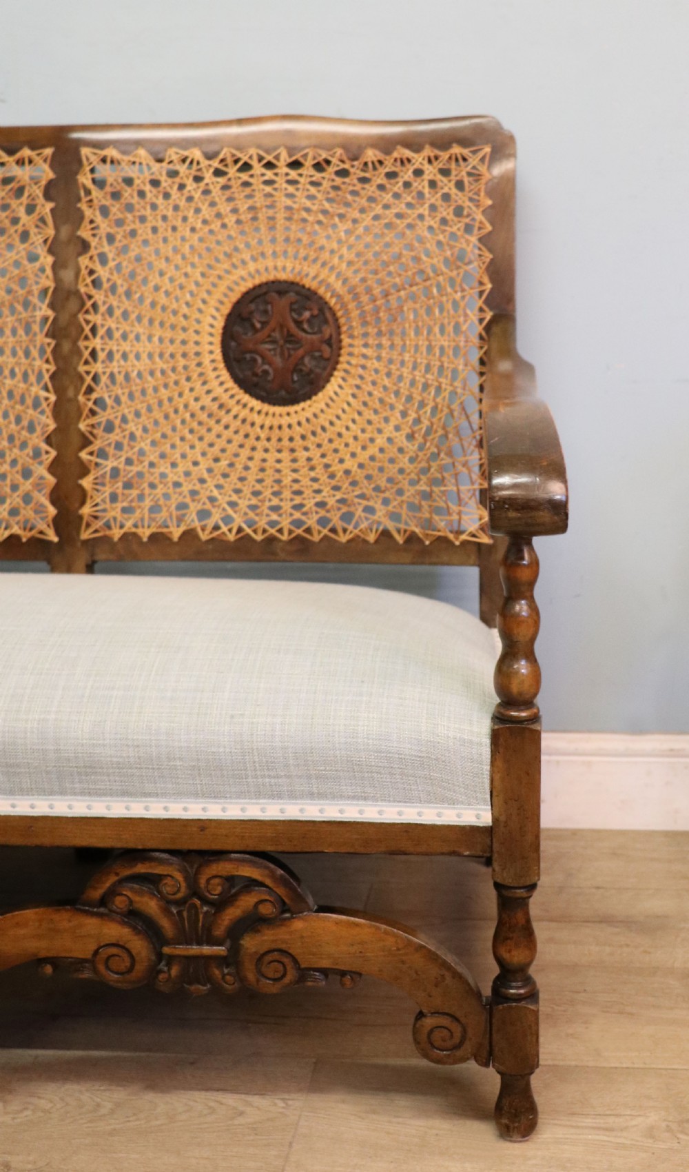  A charming early 20th century two-seater solid oak framed sofa modelled in the late 17th century style.  View XI