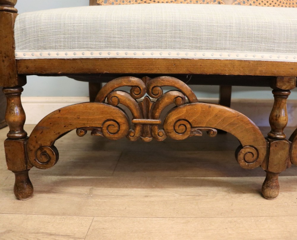  A charming early 20th century two-seater solid oak framed sofa modelled in the late 17th century style.  View XV