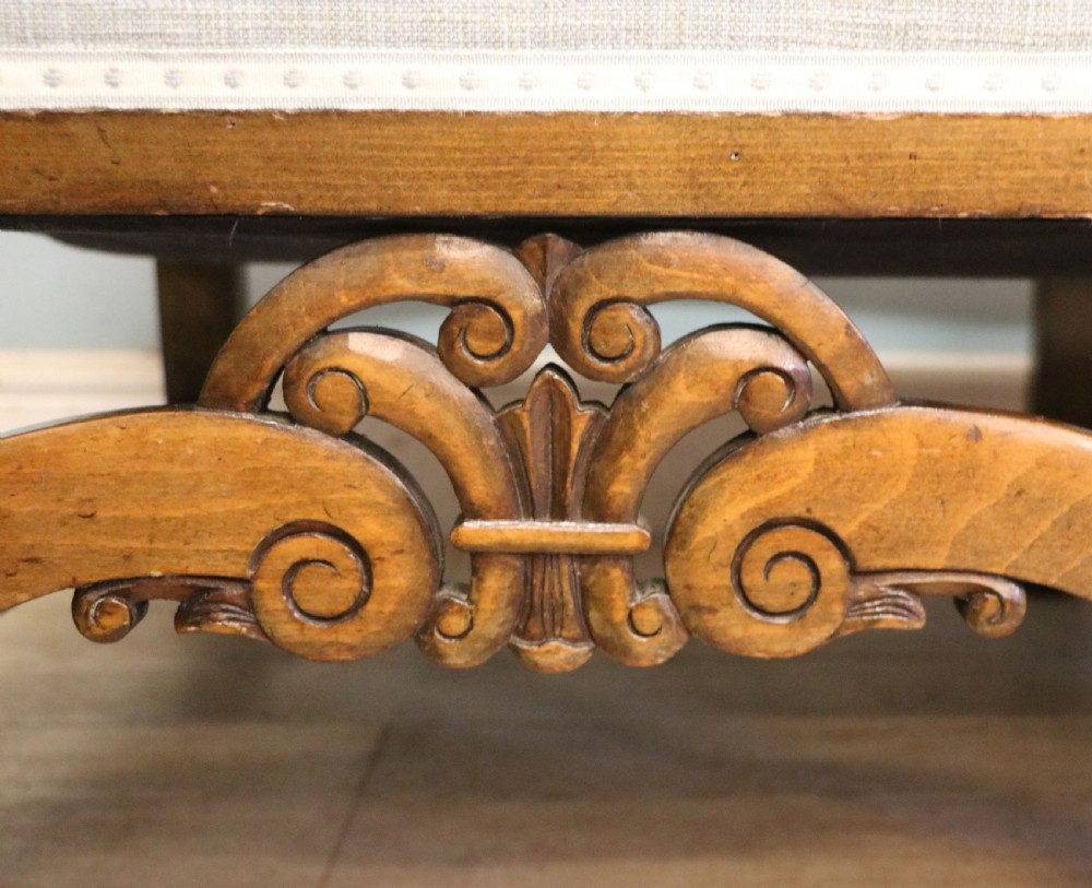  A charming early 20th century two-seater solid oak framed sofa modelled in the late 17th century style.  View XVI
