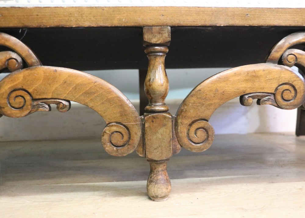  A charming early 20th century two-seater solid oak framed sofa modelled in the late 17th century style.  View XVII