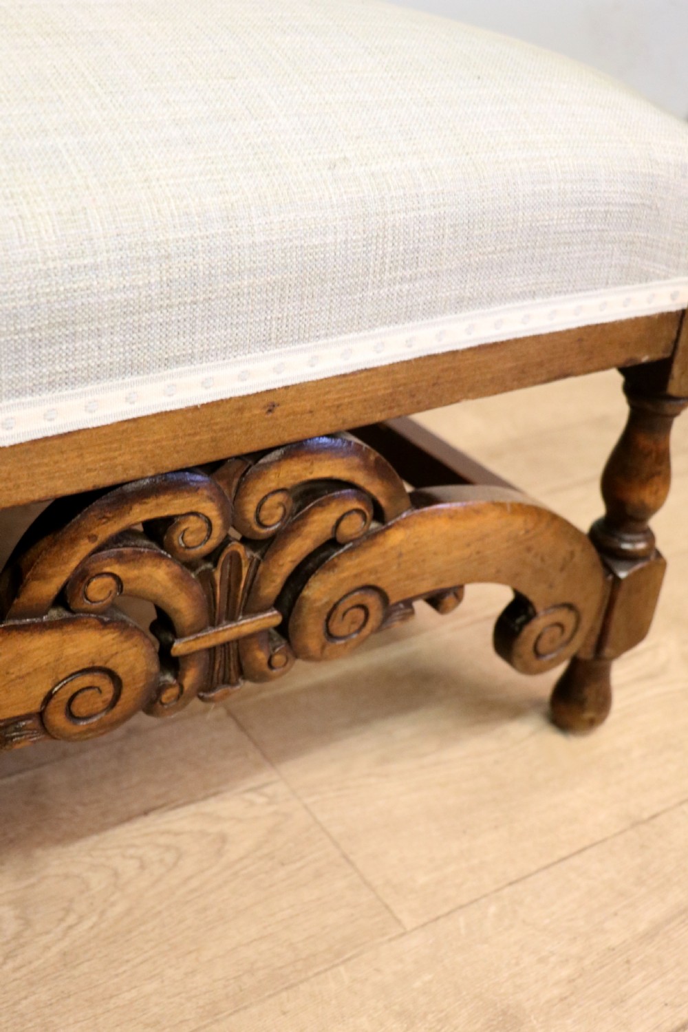  A charming early 20th century two-seater solid oak framed sofa modelled in the late 17th century style.  View XXI