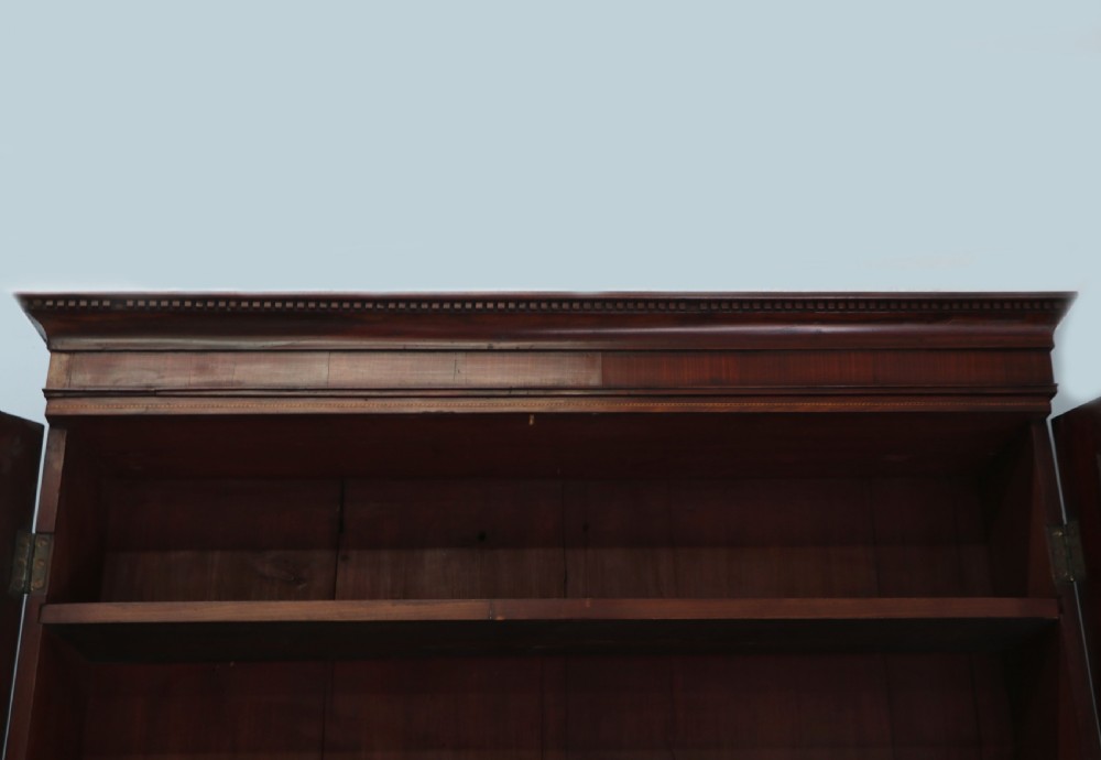 Late eighteenth-century mahogany bureau bookcase with an upper glazed cabinet featuring geometric astragal bars, an open fall-front writing surface, and lower drawers with brass handles. View VIII