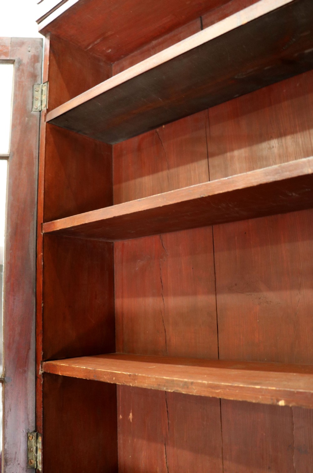 Late eighteenth-century mahogany bureau bookcase with an upper glazed cabinet featuring geometric astragal bars, an open fall-front writing surface, and lower drawers with brass handles. View IX