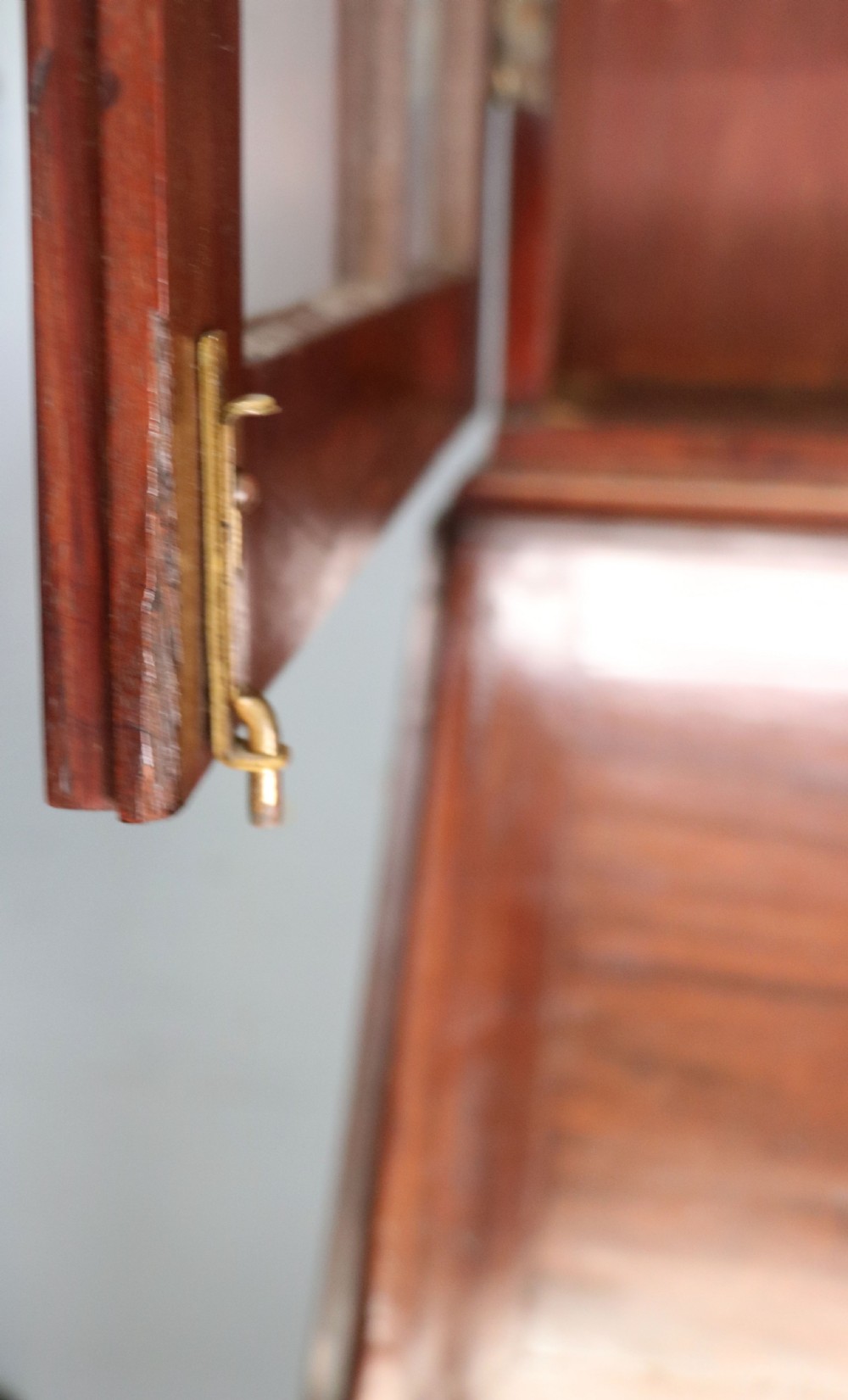 Late eighteenth-century mahogany bureau bookcase with an upper glazed cabinet featuring geometric astragal bars, an open fall-front writing surface, and lower drawers with brass handles. View XI