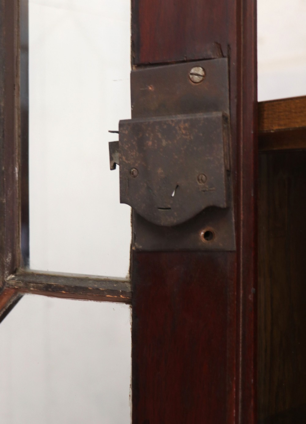 Late eighteenth-century mahogany bureau bookcase with an upper glazed cabinet featuring geometric astragal bars, an open fall-front writing surface, and lower drawers with brass handles. View XIII