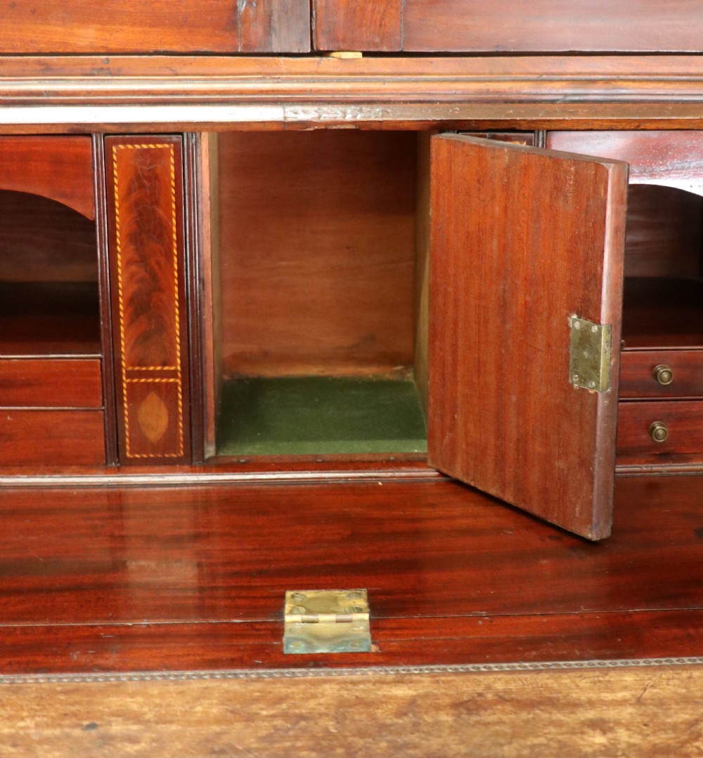 Late eighteenth-century mahogany bureau bookcase with an upper glazed cabinet featuring geometric astragal bars, an open fall-front writing surface, and lower drawers with brass handles. View XXI
