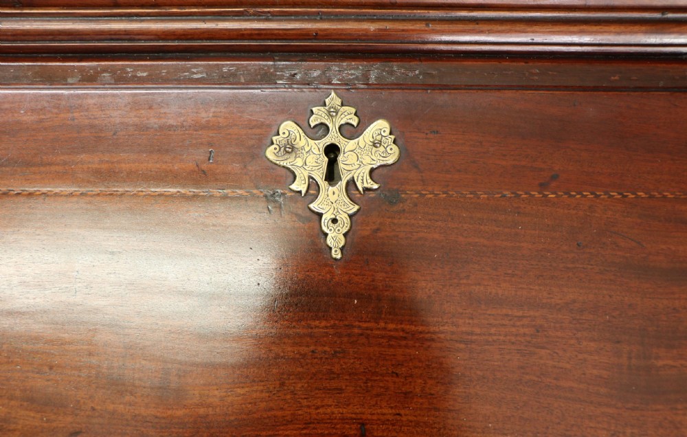 Late eighteenth-century mahogany bureau bookcase with an upper glazed cabinet featuring geometric astragal bars, an open fall-front writing surface, and lower drawers with brass handles. View XXIX