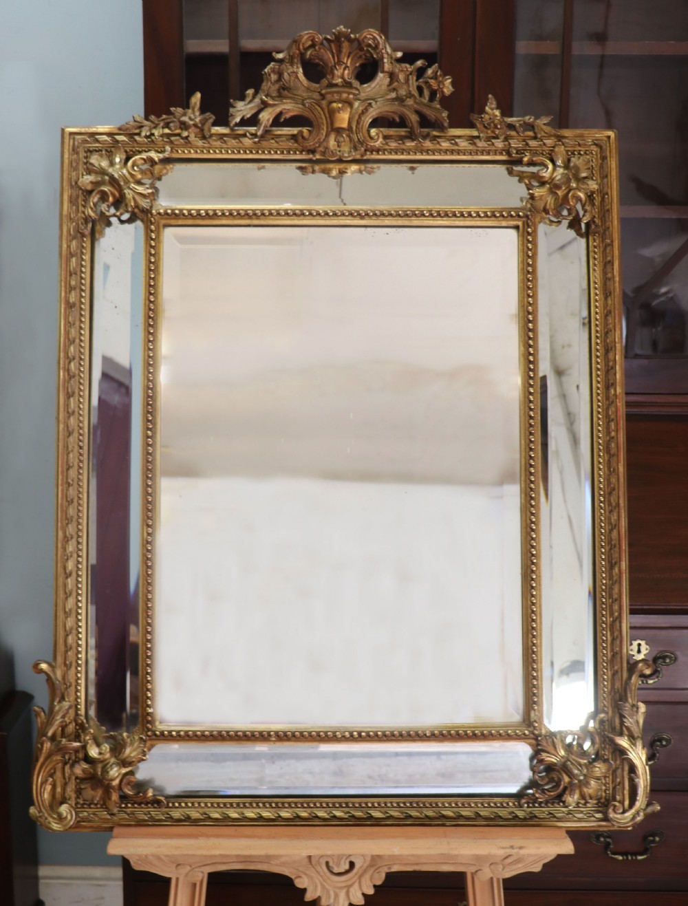 This lovely 19th century French mirror is of cushion form.
