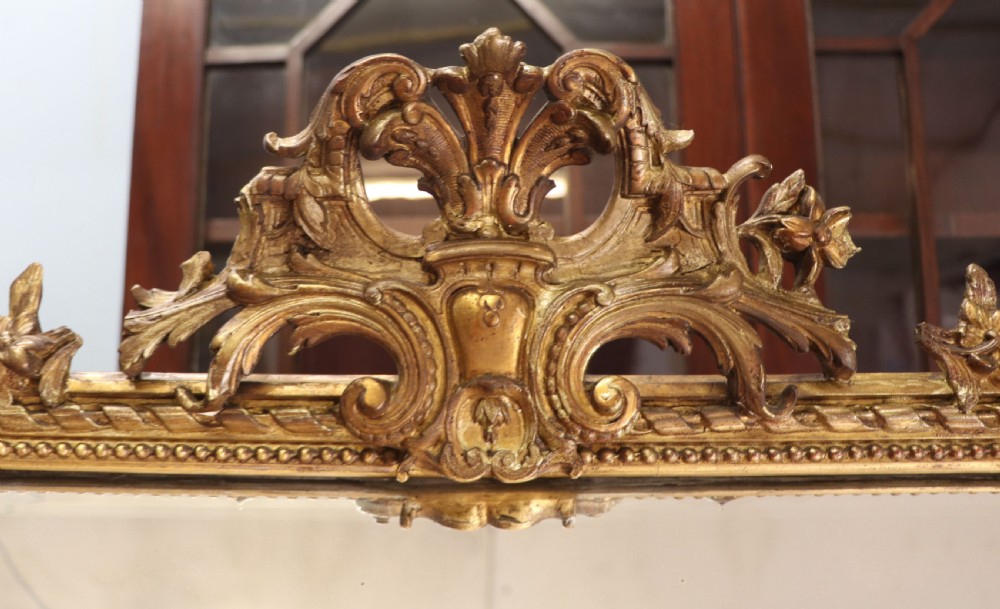 This lovely 19th century French mirror is of cushion form. View VI