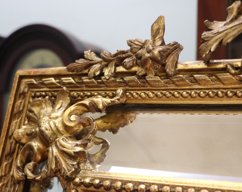 This lovely 19th century French mirror is of cushion form. View VII
